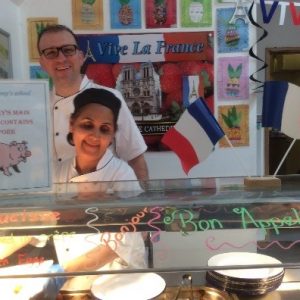 school catering staff serving french food